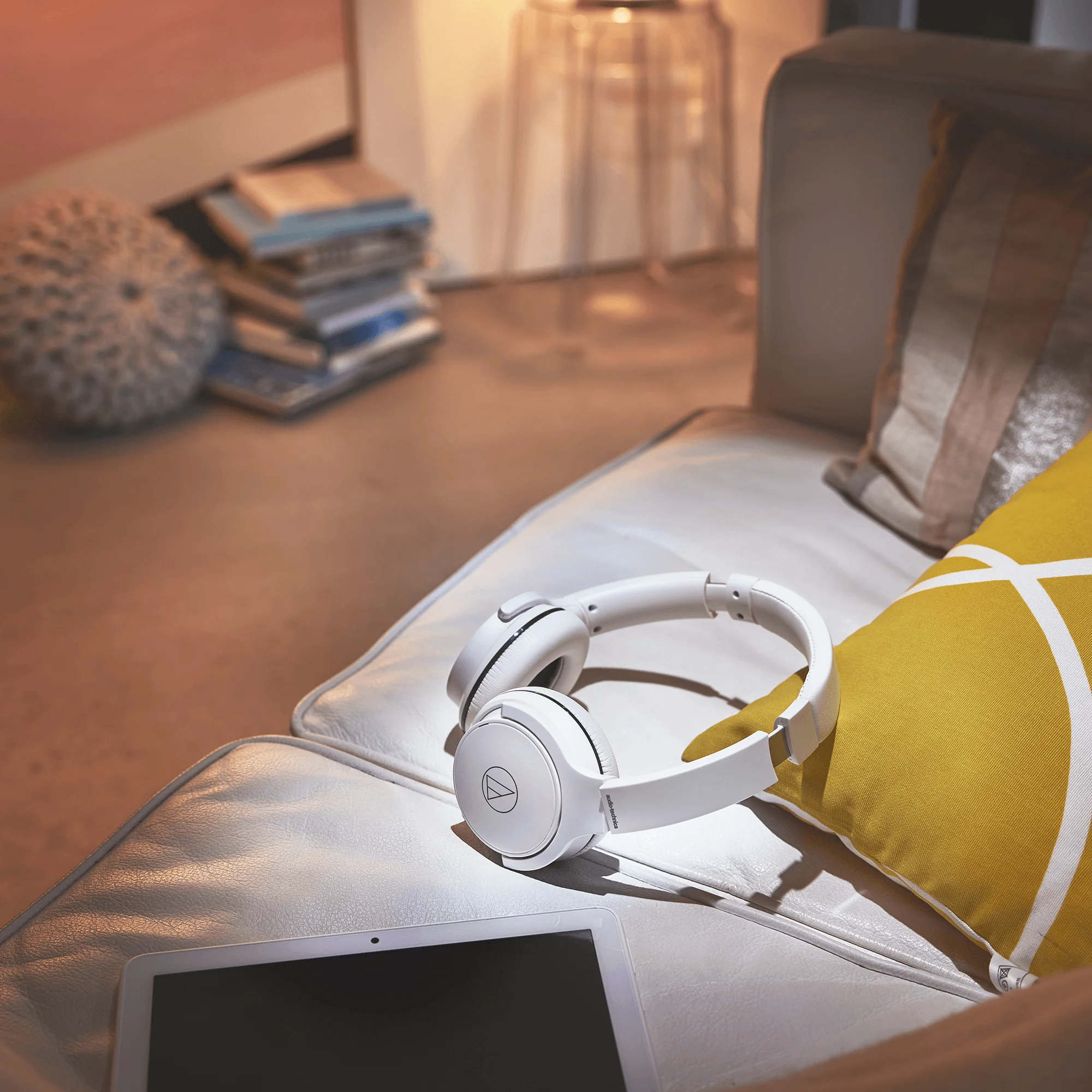 ATH-S220BT Wireless Headphones resting on sofa